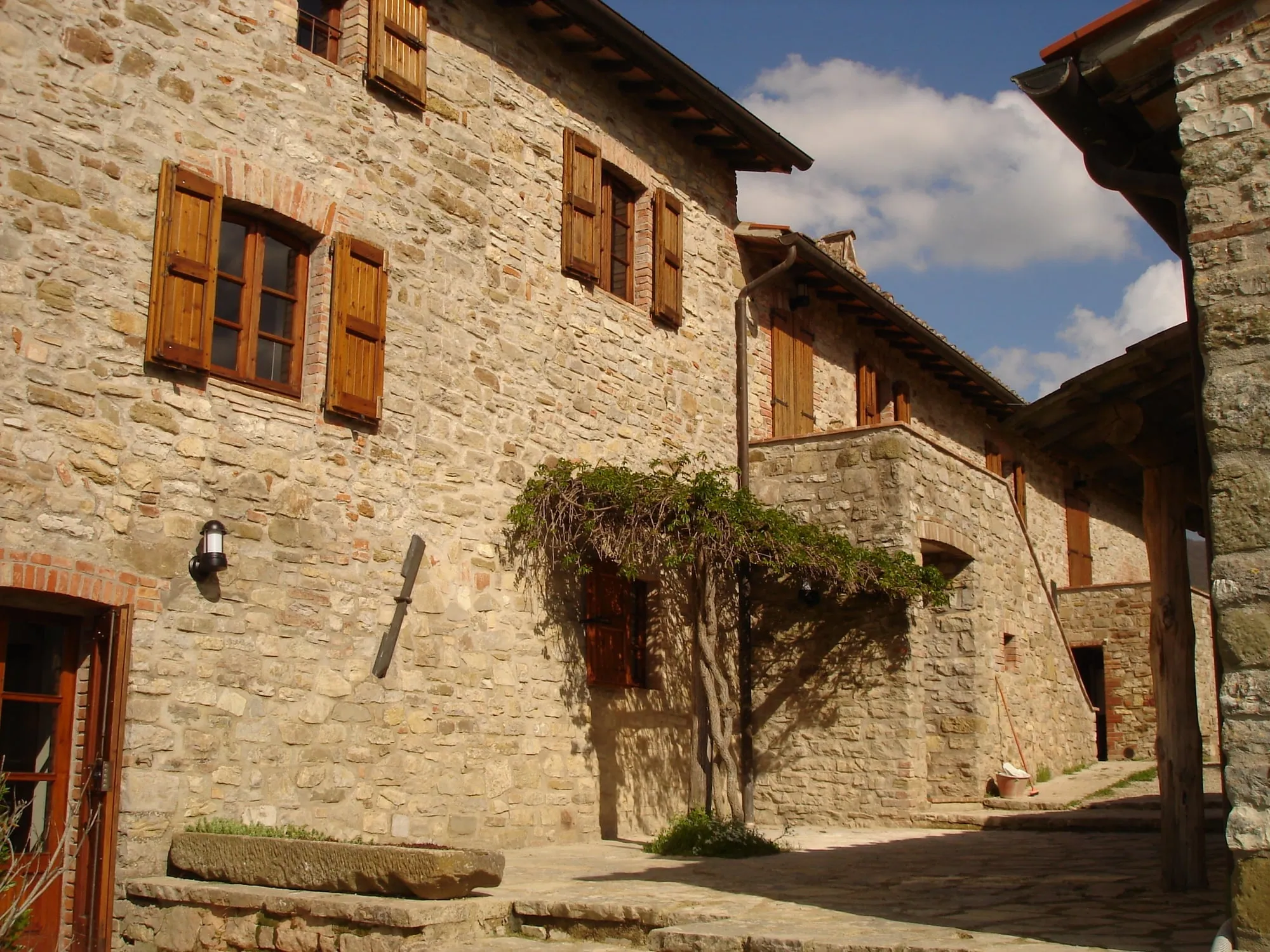 Stone farmhouse with wisteria